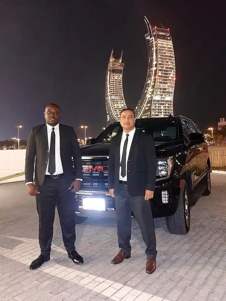 Discreet executive close protection operation in Lusail, Doha, demonstrating professional vehicle-based security and low-profile protective posture.