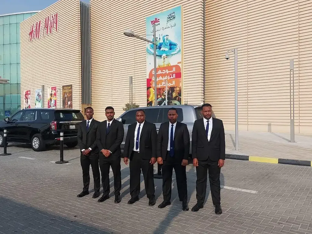 TrustForce’s close protection team standing in formation outside Doha Festival City, delivering MOI-licensed VIP security for high-profile events and celebrity appearances in Qatar.