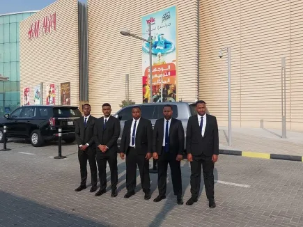 TrustForce’s close protection team standing in formation outside Doha Festival City, delivering MOI-licensed VIP security for high-profile events and celebrity appearances in Qatar.