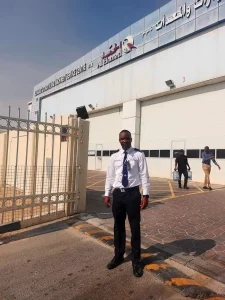 MOI-certified security guard from TrustForce securing Al Hamad Automotive and Machinery Service Centre in Doha, Qatar.