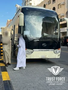 Passenger boarding a coach bus for TrustForce group evacuation transport from Doha, Qatar to Saudi Arabia