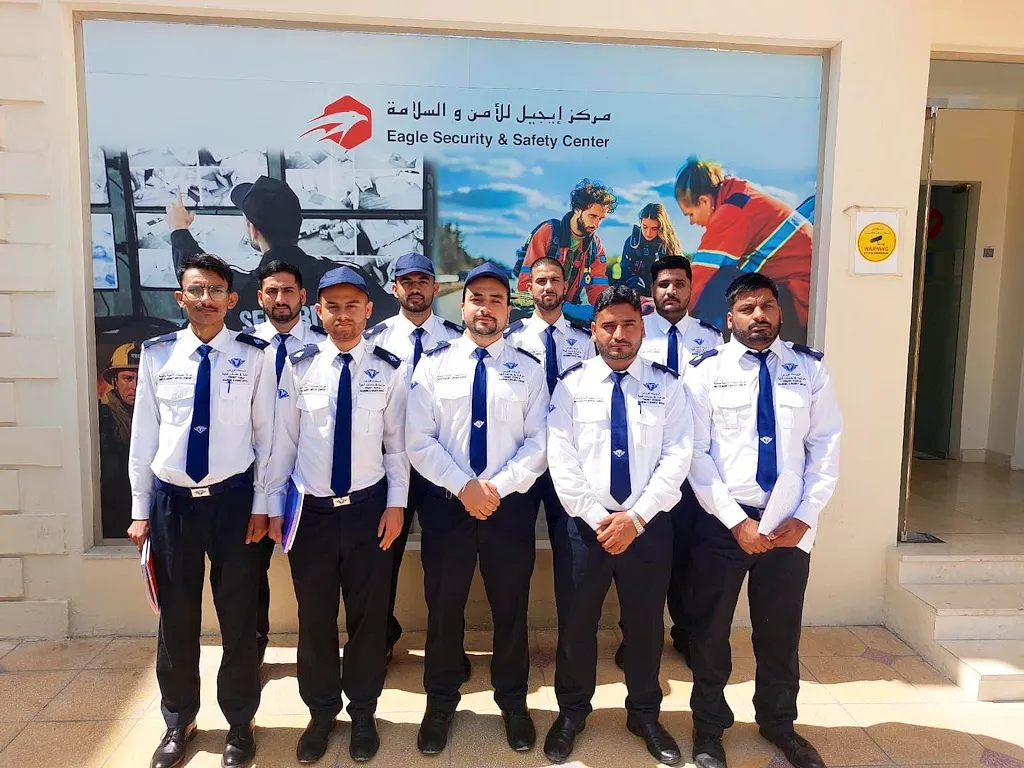 Group of uniformed TrustForce security guards standing together after completing security training in Qatar