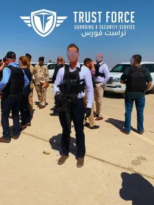 TrustForce armed security operative in body armour and tactical vest on deployment during a high risk security operation