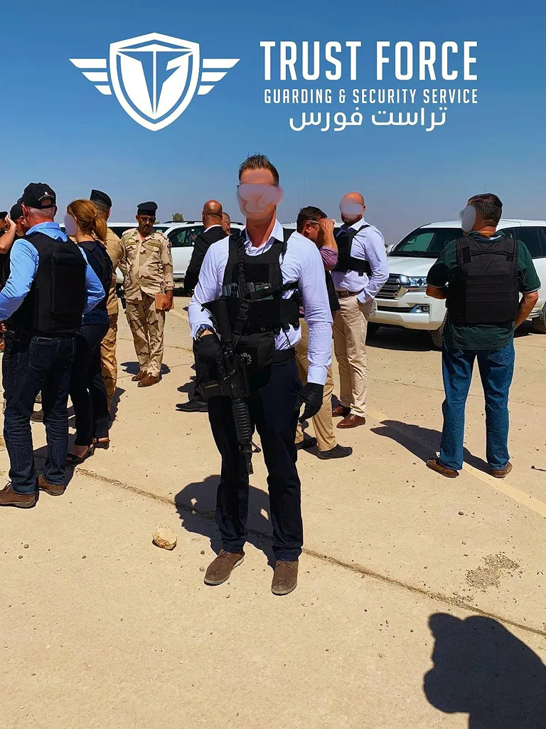 TrustForce armed security operative in body armour and tactical vest on deployment during a high risk security operation