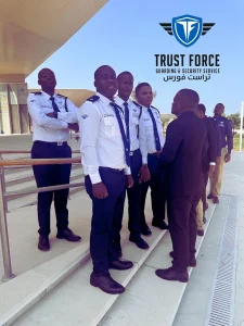 TrustForce security supervisor briefing a team of uniformed security guards at a public venue site in Qatar